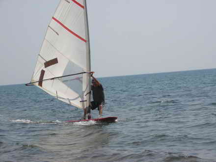 Windsurfer is close to the shore