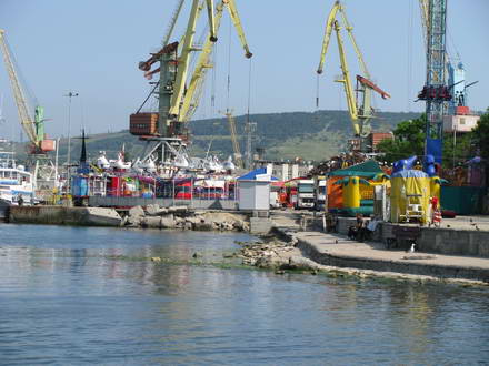 Rides on the background of the port
